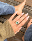 LAY WITH ME IN A FIELD OF FLOWERS // ANTIQUE EMERALD AND DIAMOND HALO RING