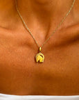 TAKE A RIDE AND GET LUCKY // 18K GOLD HORSE AND HORSESHOE PENDANT