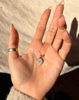 THERE IS THIS STRONG HALO AROUND YOUR HEART, LIKE A SHIELD OF LOVE // DIAMOND SHIELD PENDANT WITH OPAL HALO