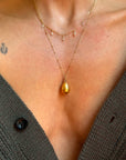WHISPER TO ME THE THINGS YOU CAN'T SAY ALOUD SO I CAN HOLD THEM TIGHTLY AND CLOSE TO MY HEART // ANTIQUE GOLDEN RUSSIAN EGG PENDANT