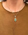 I AM EVERGREEN, TALL AS THE PINES AND CONSTANT IN MY EFFORTS // 5.05 EMERALD SHIELD CUT PENDANT