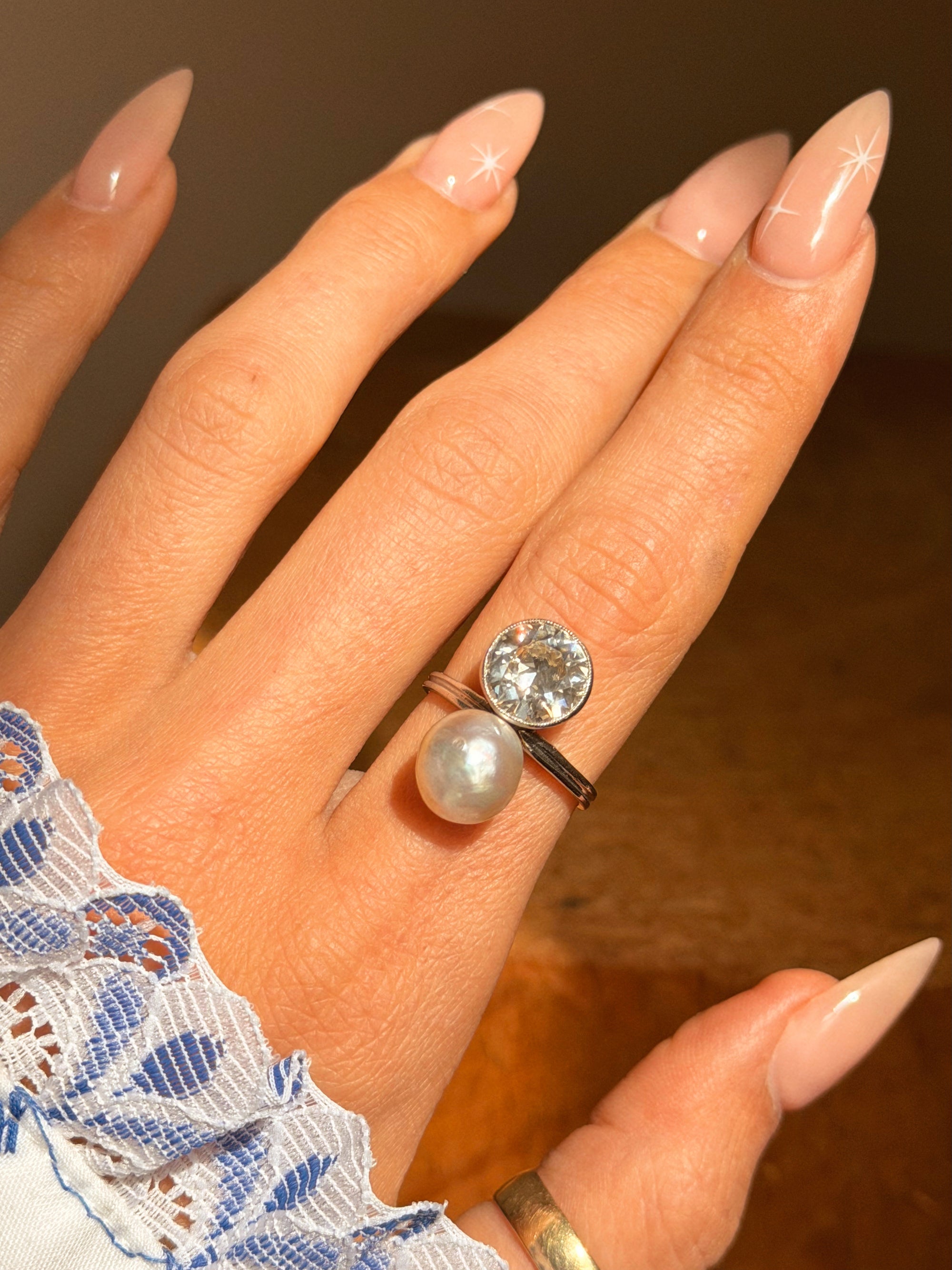 I BELIEVE THE SEA MADE THIS FOR ME SO THAT I COULD WATCH IT RISE AND FALL ON YOUR SKIN AS YOU DOZED BY THE ROCKS // ART DECO DIAMOND AND PEARL TOI ET MOI RING