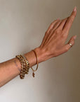 I CARRY LUCK WITH ME WHEREVER I GO // VINTAGE 18K GOLD BANGLE WITH FOUR LEAF CLOVER