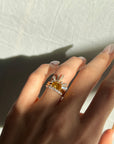 FOLLOW THE SUN RING WITH STACKING BAND AND BAGUETTE HALO