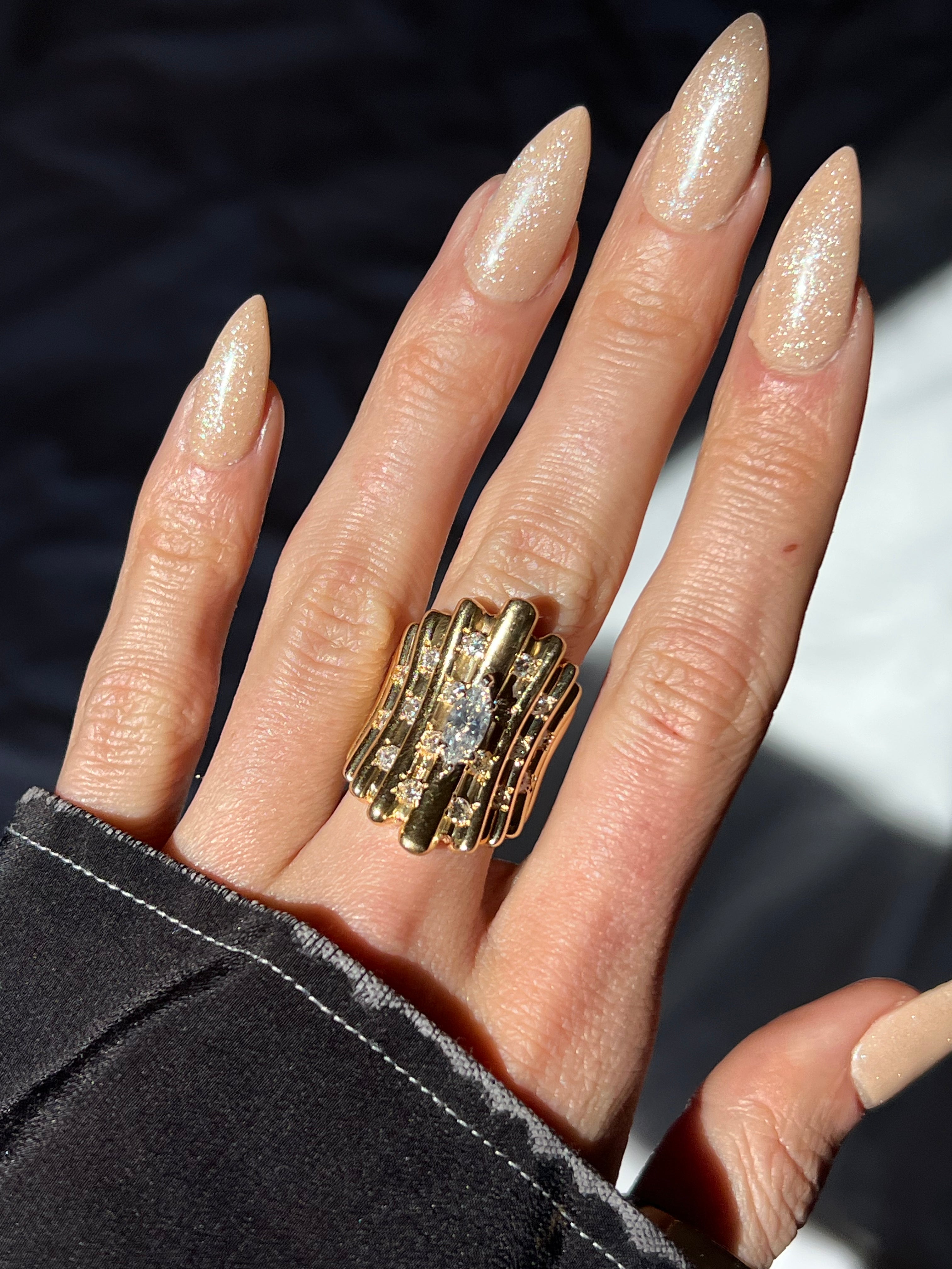 THE RUCHED RIBBON MARQUISE STATEMENT RING