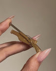 CHKK, CHKK, PULL // VINTAGE MELLERIO FRANCE HUNTING RIFLE BROOCH