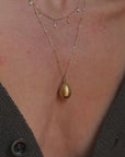 WHISPER TO ME THE THINGS YOU CAN'T SAY ALOUD SO I CAN HOLD THEM TIGHTLY AND CLOSE TO MY HEART // ANTIQUE GOLDEN RUSSIAN EGG PENDANT