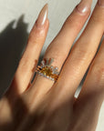 FOLLOW THE SUN RING WITH STACKING BAND AND BAGUETTE HALO