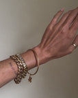 I CARRY LUCK WITH ME WHEREVER I GO // VINTAGE 18K GOLD BANGLE WITH FOUR LEAF CLOVER
