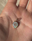 THERE IS THIS STRONG HALO AROUND YOUR HEART, LIKE A SHIELD OF LOVE // DIAMOND SHIELD PENDANT WITH OPAL HALO